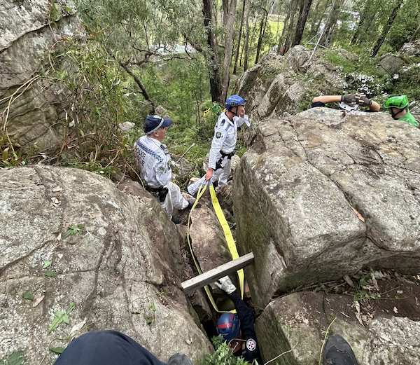 workers from NSW Ambulance removing rocks to free trapped woman